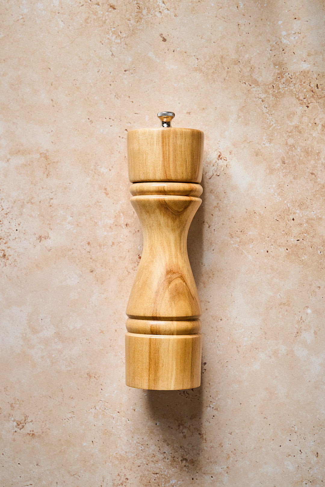 Uncluttered shot showing the modern form of the handmade pepper mill.