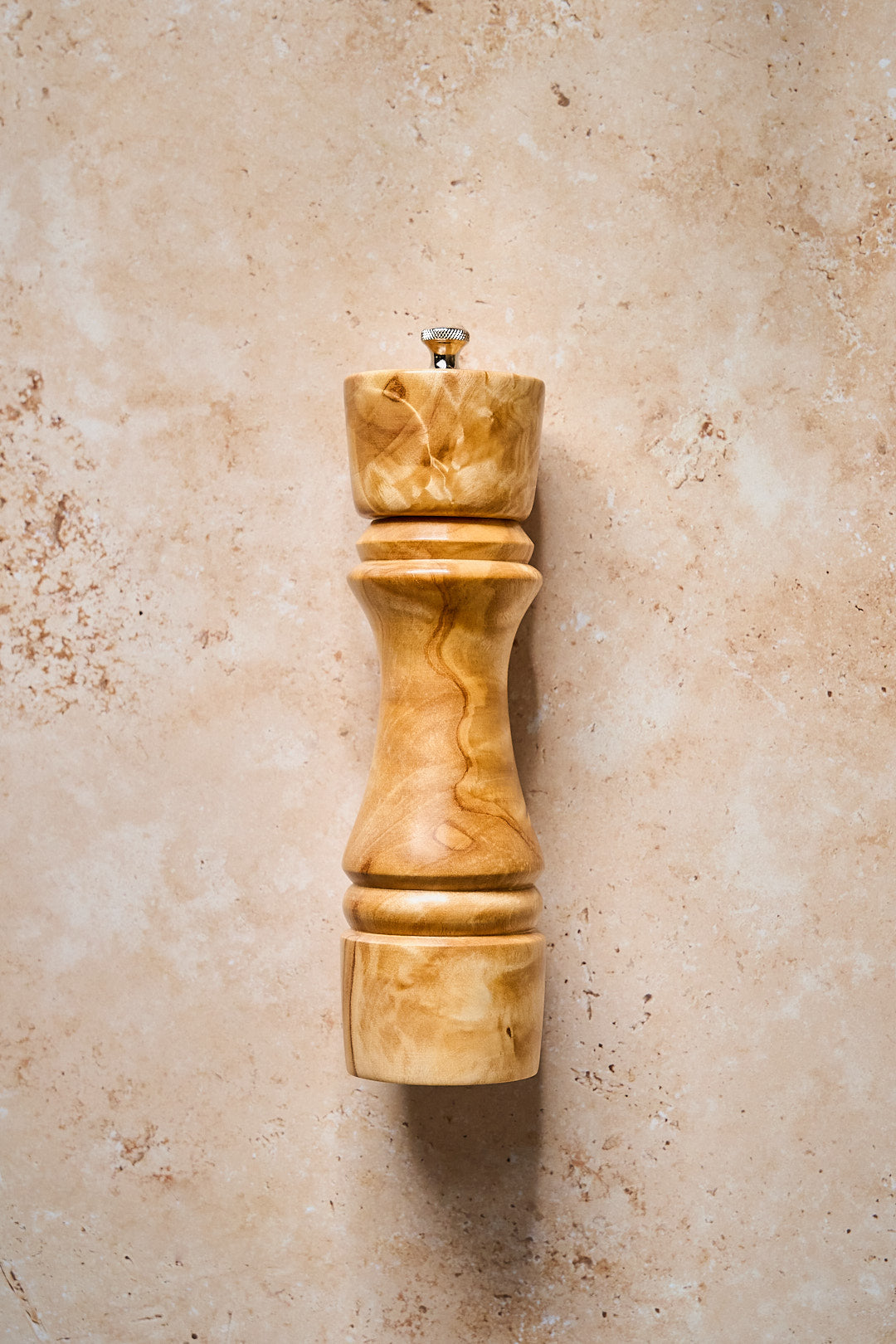 Handmade pepper grinder made from beautiful wood, showcasing craftsmanship and perfect for any kitchen.
