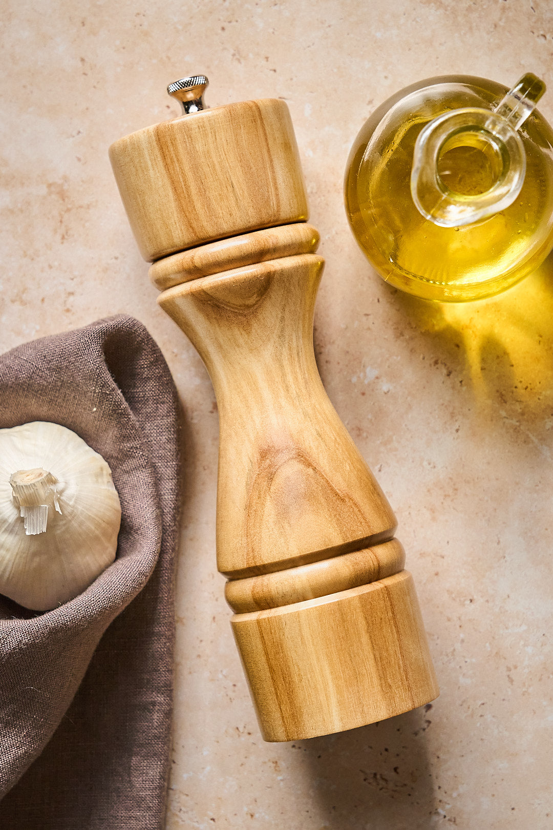 Overhead shot of handmade pepper mill made from light birch wood.