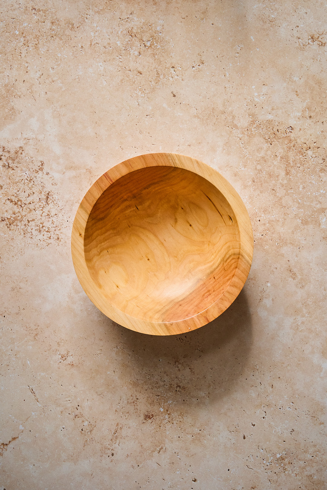 Overhead shot of the empty handmade wooden bowl.