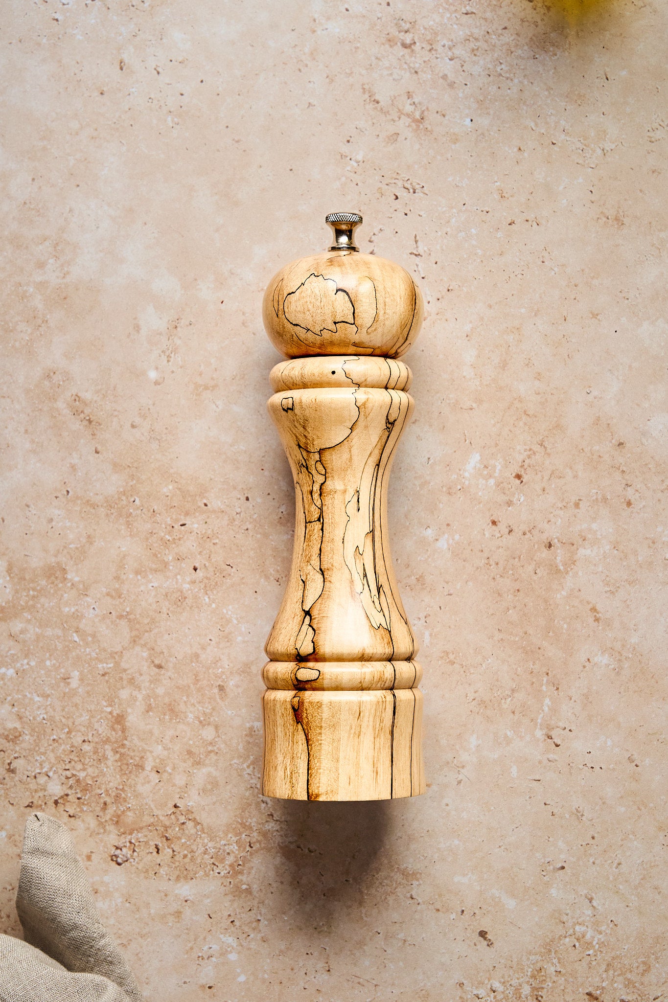 Simple shot featuring the tall pepper mill made from apple wood