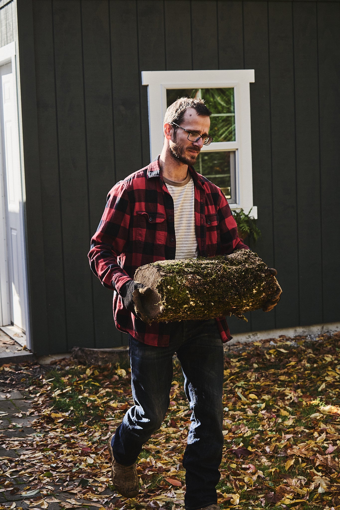 The maker brings a log back to his workshop to begin crafting a bowl
