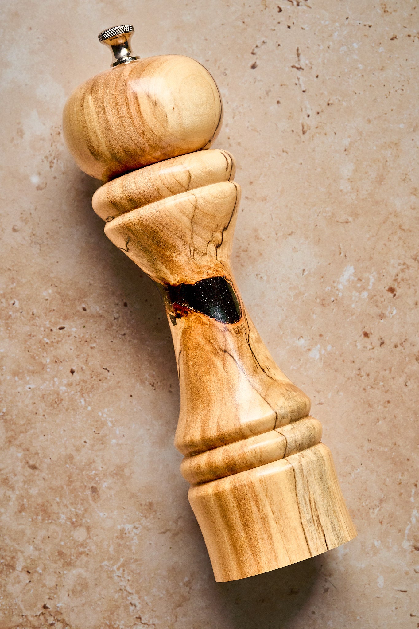 Close-up of the unique pepper grinder showing the one-of-a-kind design