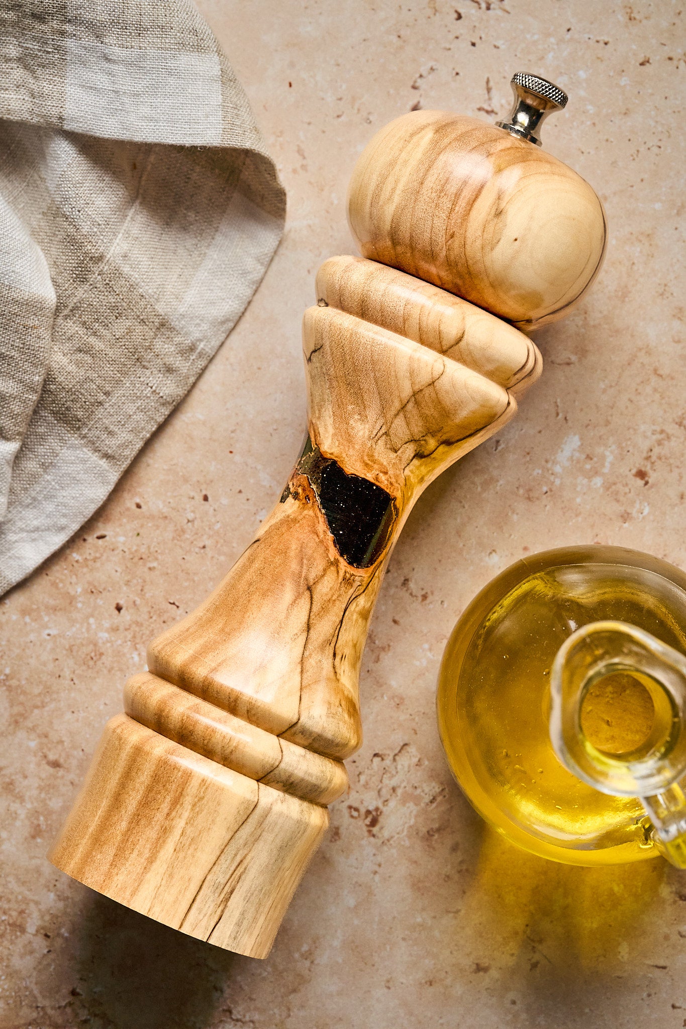 Shot of the unique pepper grinder, featuring the dark filled void making it one-of-a-kind