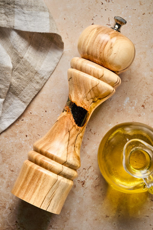 Shot of the unique pepper grinder, featuring the dark filled void making it one-of-a-kind