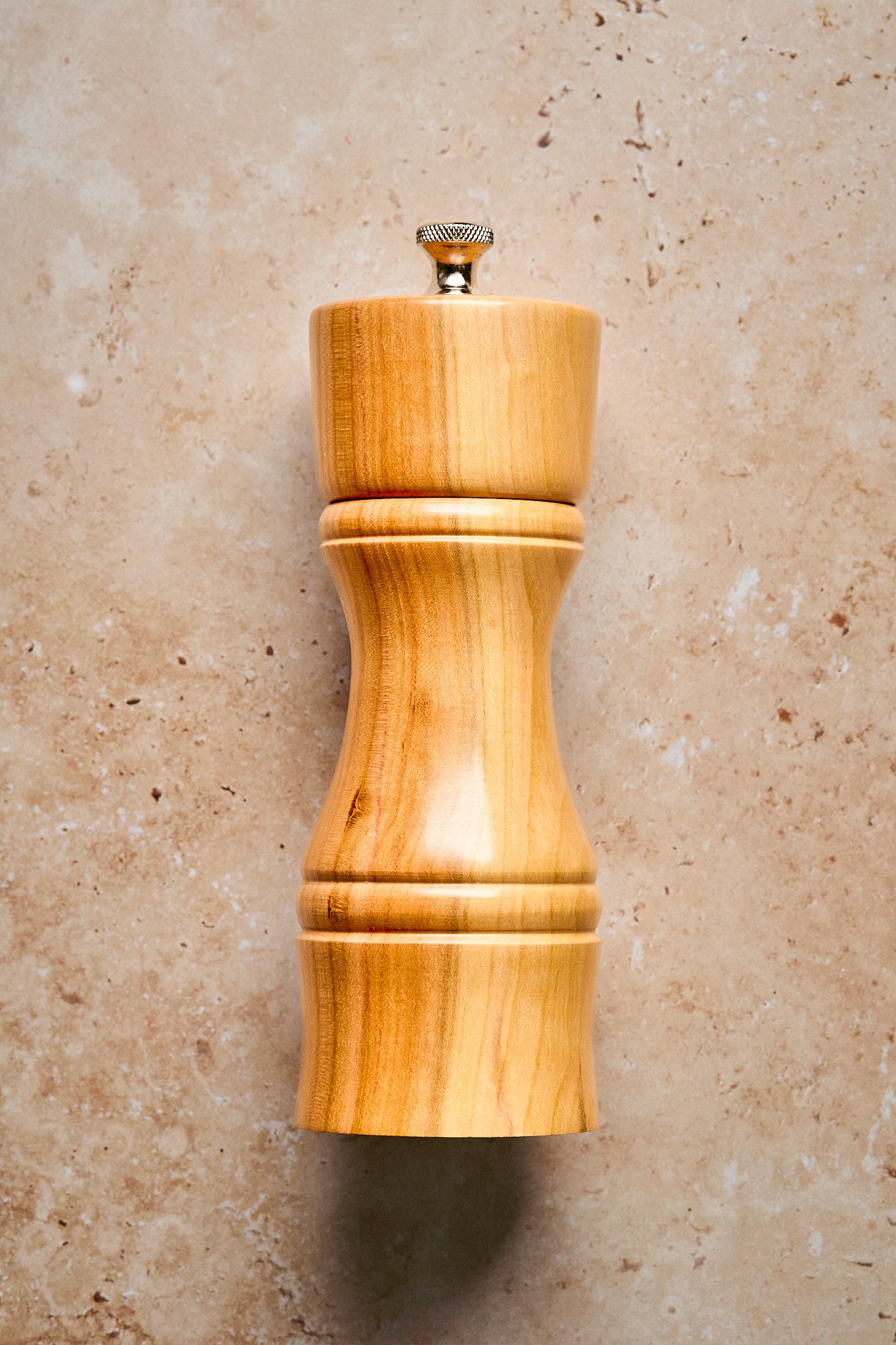 Close-up of the modern pepper mill showing the clean lines and scandi design.